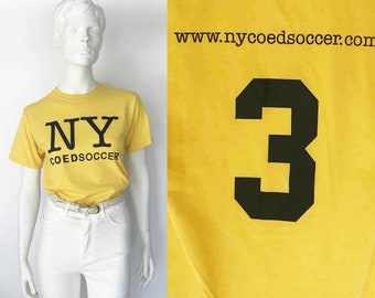 The New York Co-Ed Soccer Logo T-Shirt Vintage 80s Cotton Tee Knit Shirt