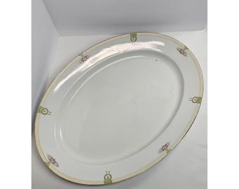 Plato ovalado antiguo de porcelana Nippon pintado a mano con borde dorado floral desconchado