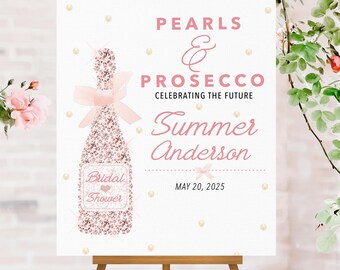 May include: A white sign on a wooden easel with the text "Pearls & Prosecco Celebrating the Future Summer Anderson May 20, 2025." A pink champagne bottle illustration is featured. Pink flowers and greenery are in the background.