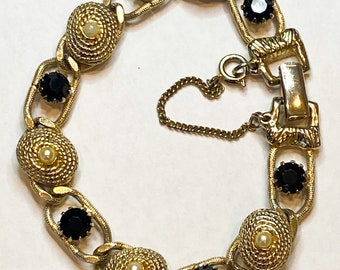 Signed Vintage 1970s Goldette NY Bracelet. Gold tone links with black crystals and pearls.