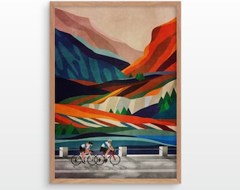 May include: Two cyclists ride on a road with a colorful mountain landscape in the background. The mountains are a mix of orange, red, blue, green, and brown. The road is gray and the sky is a light blue.