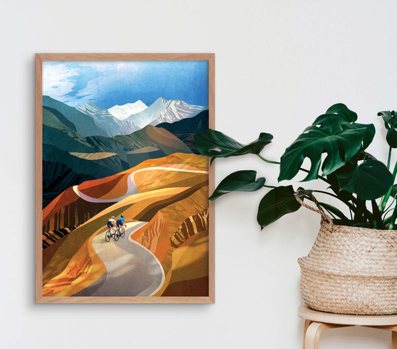 May include: A digital illustration of two cyclists riding up a winding road through a mountain landscape. The sky is blue with white clouds and the mountains are a mix of green, brown, and white.