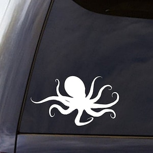 May include: White vinyl decal of an octopus with eight tentacles. The octopus is facing right and has a round body. The decal is on a black car window.