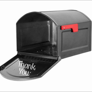 May include: A black mailbox with a red flag and a white inscription that says "Thank You" on the front.