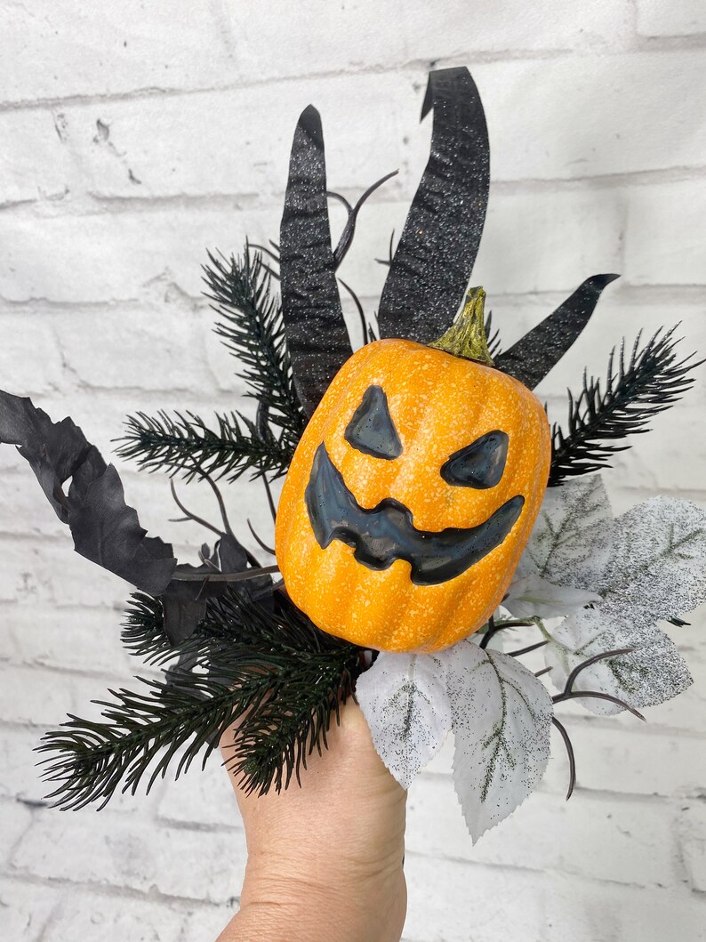 Jack-O- Lantern floral pick with grasses and black twigs