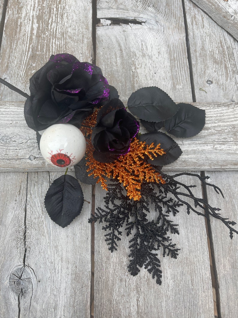 Halloween Eyeball in Rose floral Stem with twigs and orange cedar