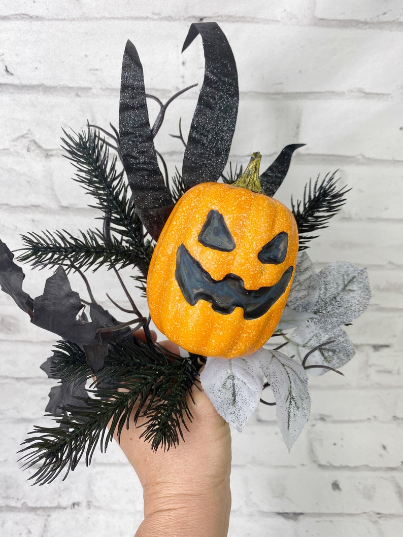 Jack-O- Lantern floral pick with grasses and black twigs