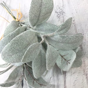 May include: A bunch of faux lambs ear stems with soft, fuzzy, gray-green leaves.