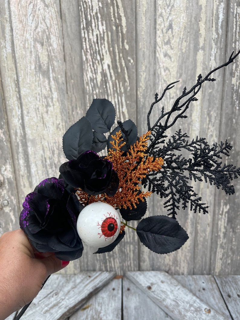 Halloween Eyeball in Rose floral Stem with twigs and orange cedar