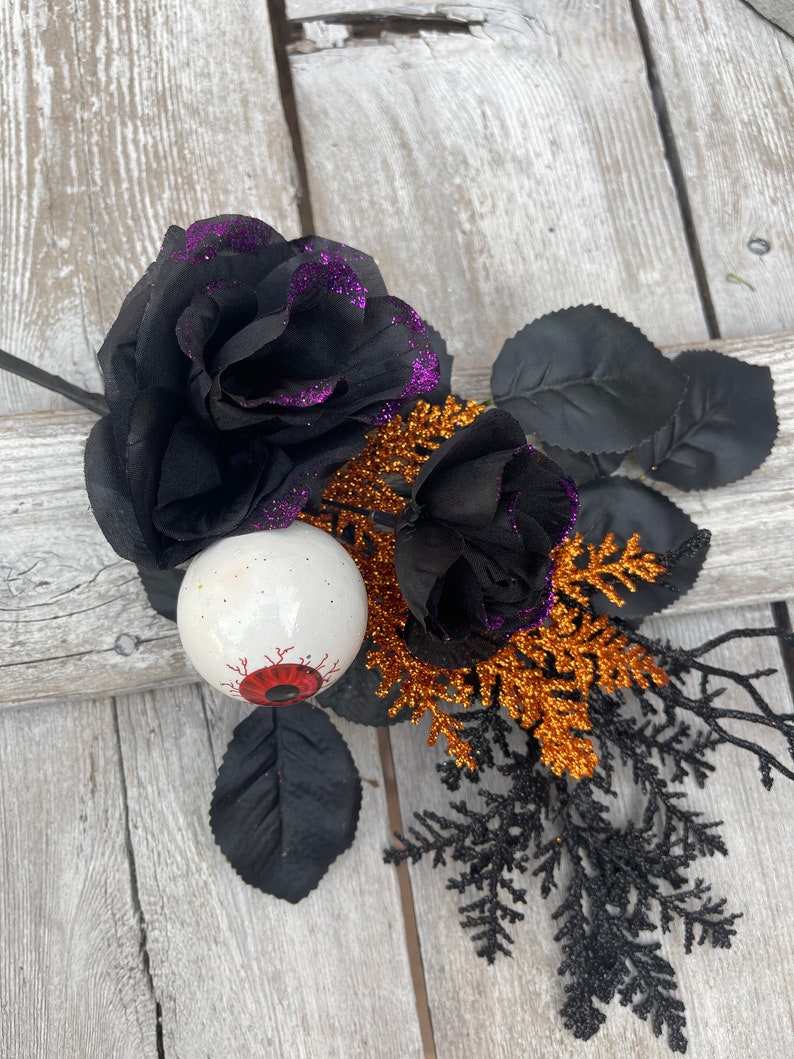 Halloween Eyeball in Rose floral Stem with twigs and orange cedar