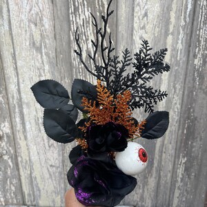 Halloween Eyeball in Rose floral Stem with twigs and orange cedar