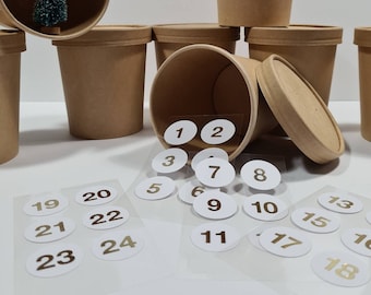 Noble advent calendar made of 24 brown paper cups with stickers in white gold