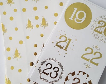 Adventskalender 24 papieren zakjes 24 stickers wit goud