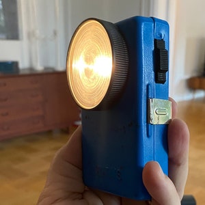 Vintage flat pocket flashlight