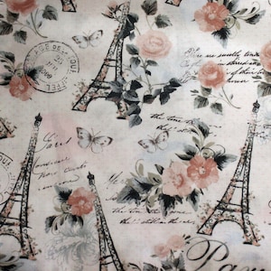 May include: A white fabric with a repeating pattern of pink roses, butterflies, and Eiffel Towers. The fabric has a vintage aesthetic with handwritten text in French.