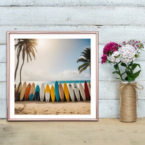 May include: A framed photograph of a beach scene with a row of colorful surfboards lined up on the sand. The surfboards are various shades of blue, green, yellow, and red. The beach is sandy with a clear blue ocean in the background. Two palm trees are visible in the distance.