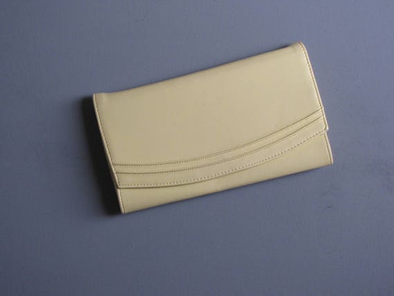 pastel yellow clutch bag