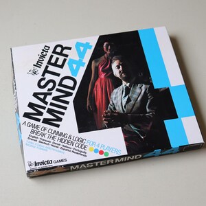 May include: A board game box for Master Mind 44, featuring a black and white design with blue accents. The box art includes a man in a suit and a woman in a red dress. The game is for 4 players.
