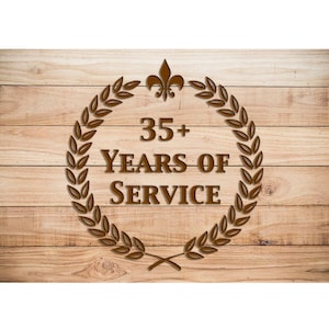 May include: A brown wooden sign with a laurel wreath and a fleur-de-lis design. The sign reads "35+ Years of Service".
