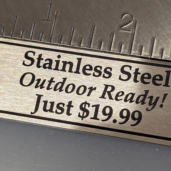 Engraved Tag, Silver Stainless Steel, Notched Corners with Black Border and Black Lettering 3.25" x 1" with 2 holes. Great for Outdoors!