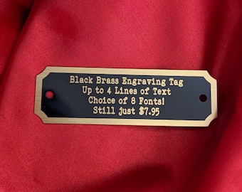Engraved Tag, Black Brass Notched Corners with Gold Border and Gold Lettering 2.75&quot; x 7/8&quot; with 2 holes. Up to 4 lines of text!