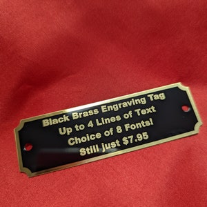 Engraved Tag, Black Brass Notched Corners with Gold Border and Gold Lettering 3 1/4" x 1" with 2 holes. Up to 4 lines of text!