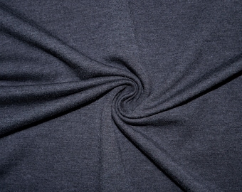 May include: Close-up of a dark gray fabric with a textured surface. The fabric is folded and draped, creating a soft, flowing look.