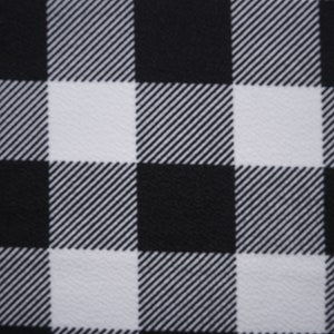 May include: Black and white checkered fabric with a subtle diagonal pattern. The fabric has a smooth, slightly textured surface.
