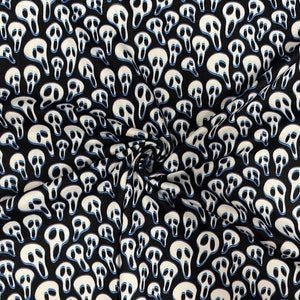 May include: A black fabric featuring a repeating pattern of white ghost-like masks with elongated black eye sockets and mouths, accented with thin blue outlines. The material is gathered in the center, creating folds and depth across the surface.
