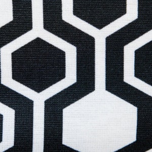 May include: Black and white geometric pattern with a honeycomb design. The pattern is made up of repeating hexagons.