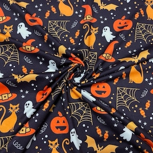 May include: A black fabric featuring a repeating Halloween pattern of orange cats, orange pumpkins, orange witch hats, white ghosts, yellow spider webs, yellow bats, and orange candies, interspersed with small white stars and dots.