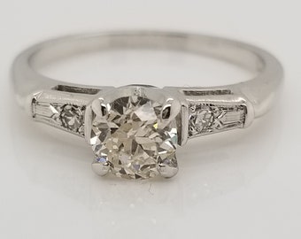 14kt White Gold, 4-prong tall setting, (5.0mm) 0.47ct RB dia, 2 small round 2 baguette accent diamonds, size 6