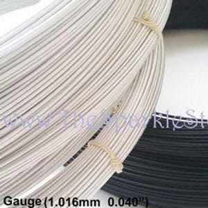 May include: Two spools of wire, one white and one black. The wire is 19 gauge, or 1.016 mm in diameter. The text on the spool reads "19 Standard Wire Gauge (1.016mm 0.040")".