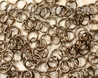 100 20ga bronze jump rings, 6.7mm OD, 5mm ID (3/16"), saw cut anodized aluminum shiny bronze rings, (#02-2004C), qty. 100