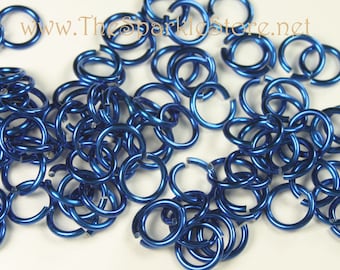 May include: A pile of blue metal jump rings. The rings are about 1/2 inch in diameter and are perfect for jewelry making.