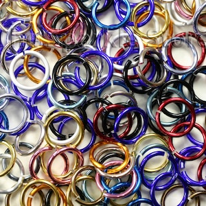 May include: A large assortment of colorful metal jump rings in various sizes. The rings are made of aluminum and are perfect for jewelry making, crafting, and other DIY projects.