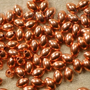 100 copper beads, 3x5mm oval, rice shape copper beads fit on 19 AWG wire, or finer, made in the USA real copper, not plated (#02-2005A)