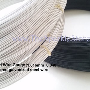 May include: Two spools of wire, one white and one black. The wire is 19 standard wire gauge (1.016mm 0.040") and is rayon covered galvanized steel wire.