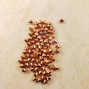 Solid copper beads, bicone shape, 3mm diameter, hole works with 22ga wire or smaller, 100 beads (#04-2006A)