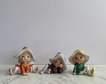 Three Vintage Homco Taiwan Pixie Elf Porcelain Figurines