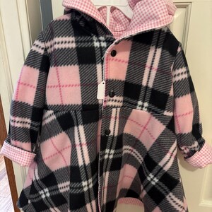 Size 4T Girls Swing Coat: Reversible fleece and flannel or cotton.  Approximately knee length.