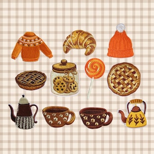 May include: A collection of embroidered patches featuring an orange sweater, a croissant, an orange beanie, a lattice-crust pie, a jar of chocolate chip cookies, an orange swirl lollipop, a second lattice pie, a brown teapot, two mugs, and a yellow kettle.