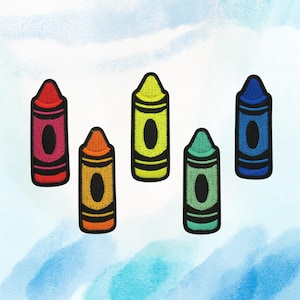May include: Five embroidered crayon patches in red, orange, yellow, green, and blue. Each patch features a black oval in the center and black outlines. The patches are arranged against a light blue and white watercolor background.