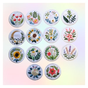 May include: A collection of embroidered floral patches in various designs. Each patch is round with a white border and features detailed depictions of flowers, including tulips, sunflowers, and lilies, in vibrant colors. The patches are suitable for decorative purposes.