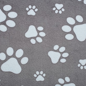 May include: Gray pet bed with a repeating pattern of white paw prints. The paw prints vary in size and are evenly distributed across the surface. The fabric has a soft, textured appearance, suitable for pets.