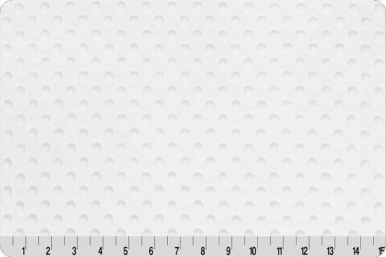 May include: White textured surface with a pattern of evenly spaced, raised, rounded bumps. A ruler with inch markings from 1 to 14 is along the bottom edge. The surface is a solid, bright white color.