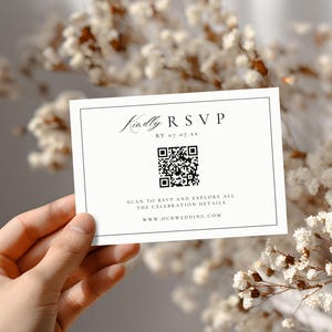 May include: A white RSVP card with black text and a QR code. The card reads "Kindly RSVP" and includes the date, "07.07.xx", and website address. The card is held in front of a blurred floral background.