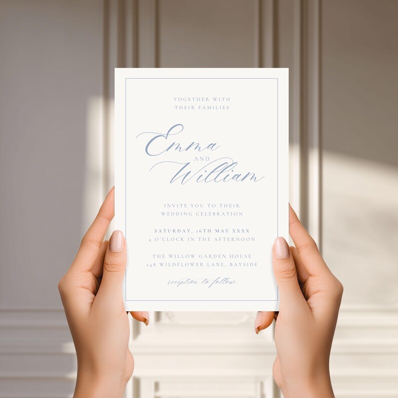 May include: A wedding invitation with a light blue border and text. The invitation reads "Emma and William" in elegant script, inviting guests to a wedding celebration. The text includes the date, time, and location.