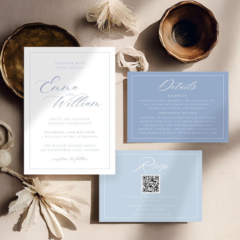 May include: Wedding invitation suite featuring a main invitation card with the names "Emma and William" in elegant script, and details cards in a soft blue hue. The suite includes RSVP and details cards, with decorative elements.