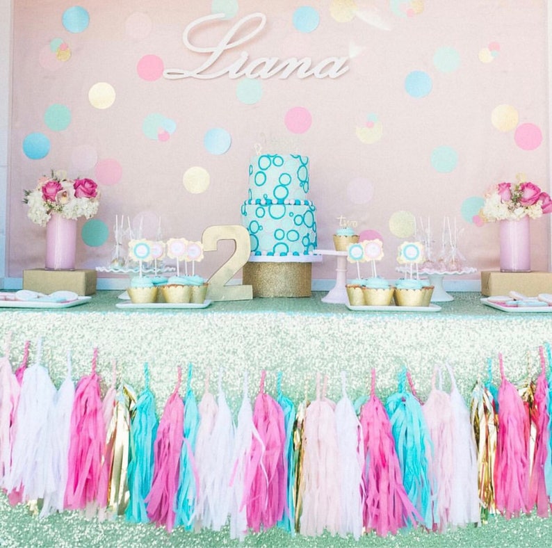 pink and gold tassel banner
